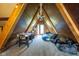 Finished attic space with A-frame ceiling, carpet, bed, and game table at 171 Williams Trce, Plainfield, IN 46168