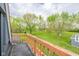 Large backyard with a wood deck and lush green trees for a picturesque view of the property from above at 171 Williams Trce, Plainfield, IN 46168
