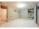 Unfinished basement with white flooring and wood-paneled walls awaiting your personal touch to transform the space at 171 Williams Trce, Plainfield, IN 46168