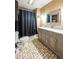 Bathroom with a double vanity, large mirror, and shower/tub combo with black shower curtain at 171 Williams Trce, Plainfield, IN 46168
