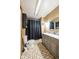 Bathroom with a double vanity, large mirror, and shower/tub combo with black shower curtain at 171 Williams Trce, Plainfield, IN 46168