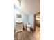 Cozy bathroom with blue walls, a pedestal sink, toilet, and vinyl flooring at 171 Williams Trce, Plainfield, IN 46168
