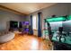 Spacious bedroom with wood floors, gaming setup, and natural light from the window at 171 Williams Trce, Plainfield, IN 46168