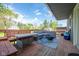 The outdoor deck features cozy seating and a stylish fire pit, great for entertaining and relaxation at 171 Williams Trce, Plainfield, IN 46168