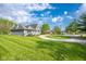 Side view of property highlighting its lush lawn, mature trees, and well-maintained landscaping at 171 Williams Trce, Plainfield, IN 46168
