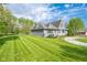 Well-maintained home with a spacious lawn, mature trees, and charming curb appeal on a sunny day at 171 Williams Trce, Plainfield, IN 46168