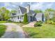 Well-maintained home features a stone chimney, manicured landscaping, and a charming front entrance at 171 Williams Trce, Plainfield, IN 46168