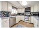 Bright kitchen with stainless steel appliances, tile backsplash, and plenty of counter space for cooking at 171 Williams Trce, Plainfield, IN 46168