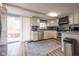 Well-equipped kitchen features stainless steel appliances, lots of cabinets, and access to outdoor deck at 171 Williams Trce, Plainfield, IN 46168