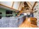 Open concept living room features high ceilings, stone accent wall, and seamless flow to the dining area at 171 Williams Trce, Plainfield, IN 46168