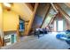 Open loft space with exposed beams, wood paneling, foosball table, and a walk-out balcony at 171 Williams Trce, Plainfield, IN 46168