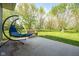Tranquil patio with a comfortable swing chair and serene outdoor setting at 171 Williams Trce, Plainfield, IN 46168