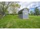 View of large backyard featuring a storage shed perfect for tools and equipment on a beautiful, sunny day at 171 Williams Trce, Plainfield, IN 46168