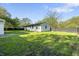 Spacious backyard featuring a lush lawn and privacy fence; an ideal outdoor living space at 1903 Danbury Dr, Indianapolis, IN 46231
