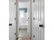 Hallway view into a bathroom with a shower and tub combination at 1903 Danbury Dr, Indianapolis, IN 46231