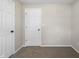 Bedroom with neutral paint, carpet, and 2 doors at 1903 Danbury Dr, Indianapolis, IN 46231
