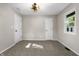 Bright bedroom with carpet, white trim, a ceiling fan and two doors at 1903 Danbury Dr, Indianapolis, IN 46231