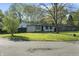 Charming home with mature trees, a lawn, and a classic design at 1903 Danbury Dr, Indianapolis, IN 46231