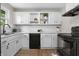 Updated kitchen with white cabinets, subway tile backsplash, and black appliances at 1903 Danbury Dr, Indianapolis, IN 46231