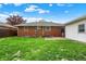 Spacious backyard with a brick house and a detached garage at 1964 Mann Dr, Beech Grove, IN 46107