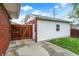 Fenced-in backyard showcasing the garage with a gated entrance at 1964 Mann Dr, Beech Grove, IN 46107