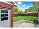 Fenced backyard with a patio space and well-maintained lawn at 1964 Mann Dr, Beech Grove, IN 46107