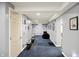 Playful basement area with dog decor, blue carpets, and ample space at 1964 Mann Dr, Beech Grove, IN 46107