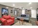 Basement entertainment area with large screen, sofa, and movie decor at 1964 Mann Dr, Beech Grove, IN 46107