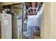 Unfinished basement with concrete walls, utility equipment, and exposed ceiling at 1964 Mann Dr, Beech Grove, IN 46107