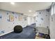 Basement room with paw print decor, black beanbag, and dog crate at 1964 Mann Dr, Beech Grove, IN 46107
