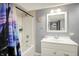 Bathroom featuring a tub-shower, modern vanity, and neutral color palette at 1964 Mann Dr, Beech Grove, IN 46107