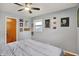 Bedroom featuring natural light, a ceiling fan, and multiple wall decorations at 1964 Mann Dr, Beech Grove, IN 46107