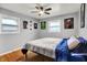 Bedroom showcasing natural light, a ceiling fan, and comic themed wall art at 1964 Mann Dr, Beech Grove, IN 46107