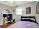Bedroom featuring hardwood floors, natural light, and a large computer setup for work at 1964 Mann Dr, Beech Grove, IN 46107