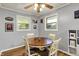 Bright dining area features natural light, a wooden table, and neutral decor at 1964 Mann Dr, Beech Grove, IN 46107
