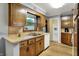 Charming kitchen with wood cabinets, modern appliances, and ample natural light at 1964 Mann Dr, Beech Grove, IN 46107