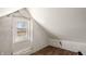 Attic featuring exposed framing and window, with wood floor at 201 N 5Th St, Elwood, IN 46036
