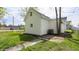Backyard with a white exterior and green grass at 201 N 5Th St, Elwood, IN 46036