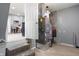 Basement area with exposed HVAC, concrete stairs and glimpse of kitchen with dining at 201 N 5Th St, Elwood, IN 46036