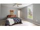 Bedroom with a bed, large window, ceiling fan, and light colored walls at 201 N 5Th St, Elwood, IN 46036
