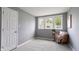 Bedroom with three windows letting in natural light and neutral walls and carpet at 201 N 5Th St, Elwood, IN 46036