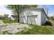 A two-car garage features white siding, providing ample parking and storage space at 201 N 5Th St, Elwood, IN 46036