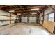 Inside view of a spacious garage with exposed beams and an open layout at 201 N 5Th St, Elwood, IN 46036