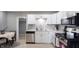 Modern kitchen featuring stainless steel appliances, white cabinets, and sleek countertops at 201 N 5Th St, Elwood, IN 46036