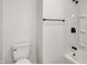 Bathroom with a toilet and bath and shower combination with modern fixtures at 2015 S Hackley St, Muncie, IN 47302