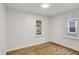 Bedroom with two windows providing natural light and wood-look flooring at 2015 S Hackley St, Muncie, IN 47302