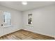 Bright bedroom with two windows providing natural light and wood-look flooring at 2015 S Hackley St, Muncie, IN 47302