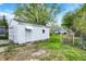 White detached garage with a door to the backyard at 2015 S Hackley St, Muncie, IN 47302