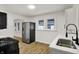 Modern kitchen featuring stainless steel appliances, sleek white cabinetry, and ample counter space for cooking at 2015 S Hackley St, Muncie, IN 47302