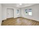 Newly renovated room with modern wood floors and a seamless flow, enhanced by abundant natural light at 2015 S Hackley St, Muncie, IN 47302